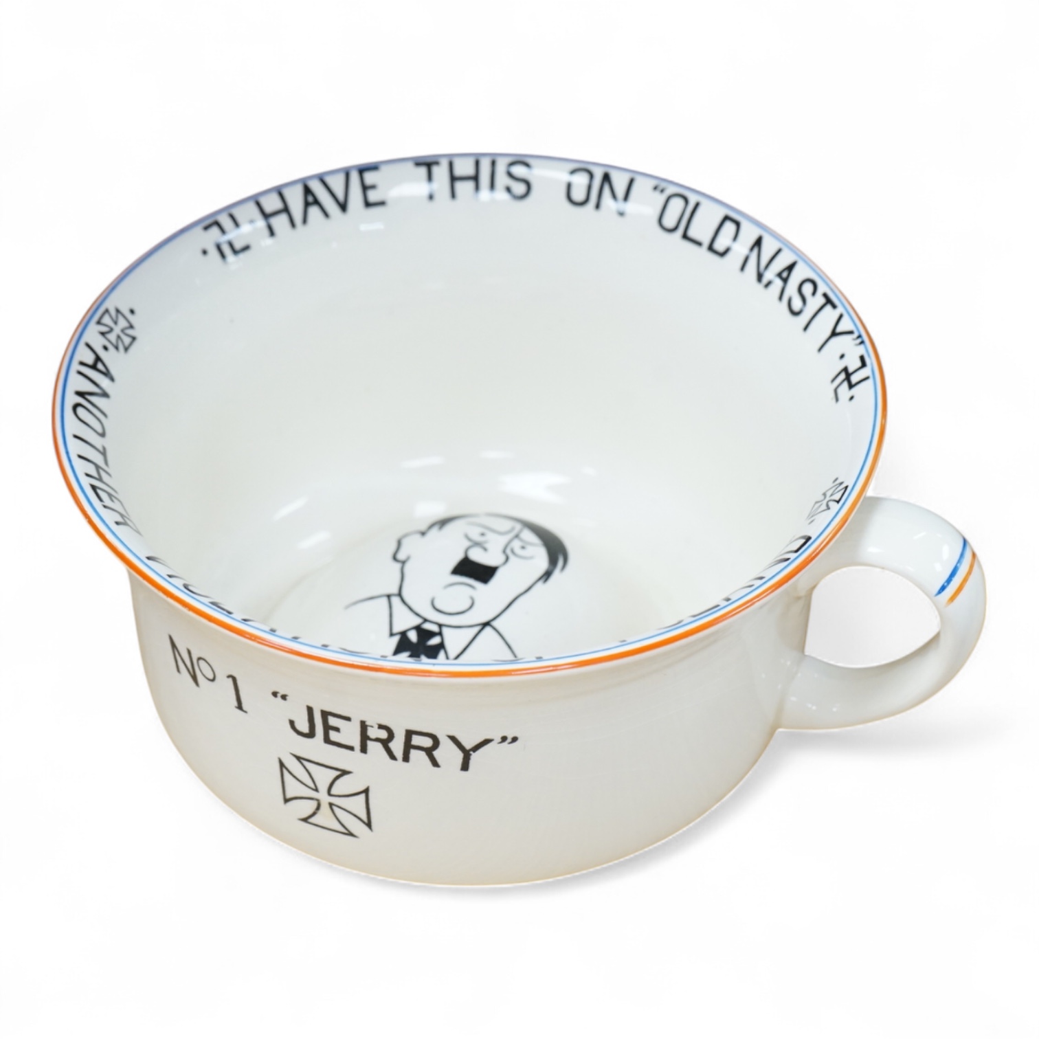 A WWII Fieldings Crown Devon novelty musical chamber pot, decorated with; No. 1 “Jerry”, Have This On Old Nasty, Another Violation of Poland and cartoon image of Adolf Hitler. Diameter 21.5cm, height 12cm
